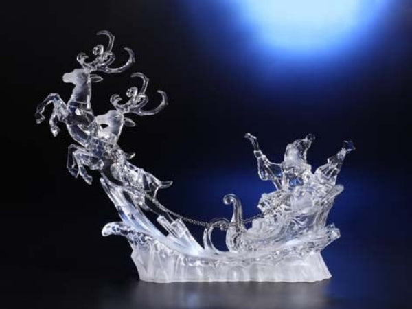 A crystal Santa Claus figurine in a sleigh, capturing the spirit of Santa Up, Up, & Away.