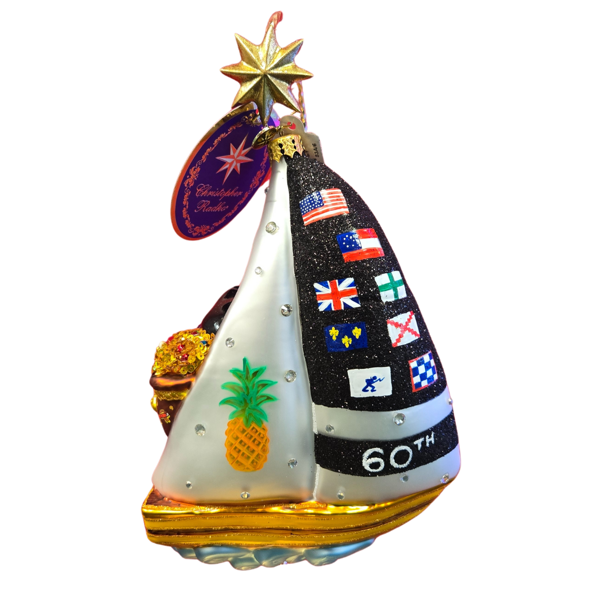 A festive ornament depicting a sailboat with colorful flags, celebrating Santa's matey Shrimpfest.